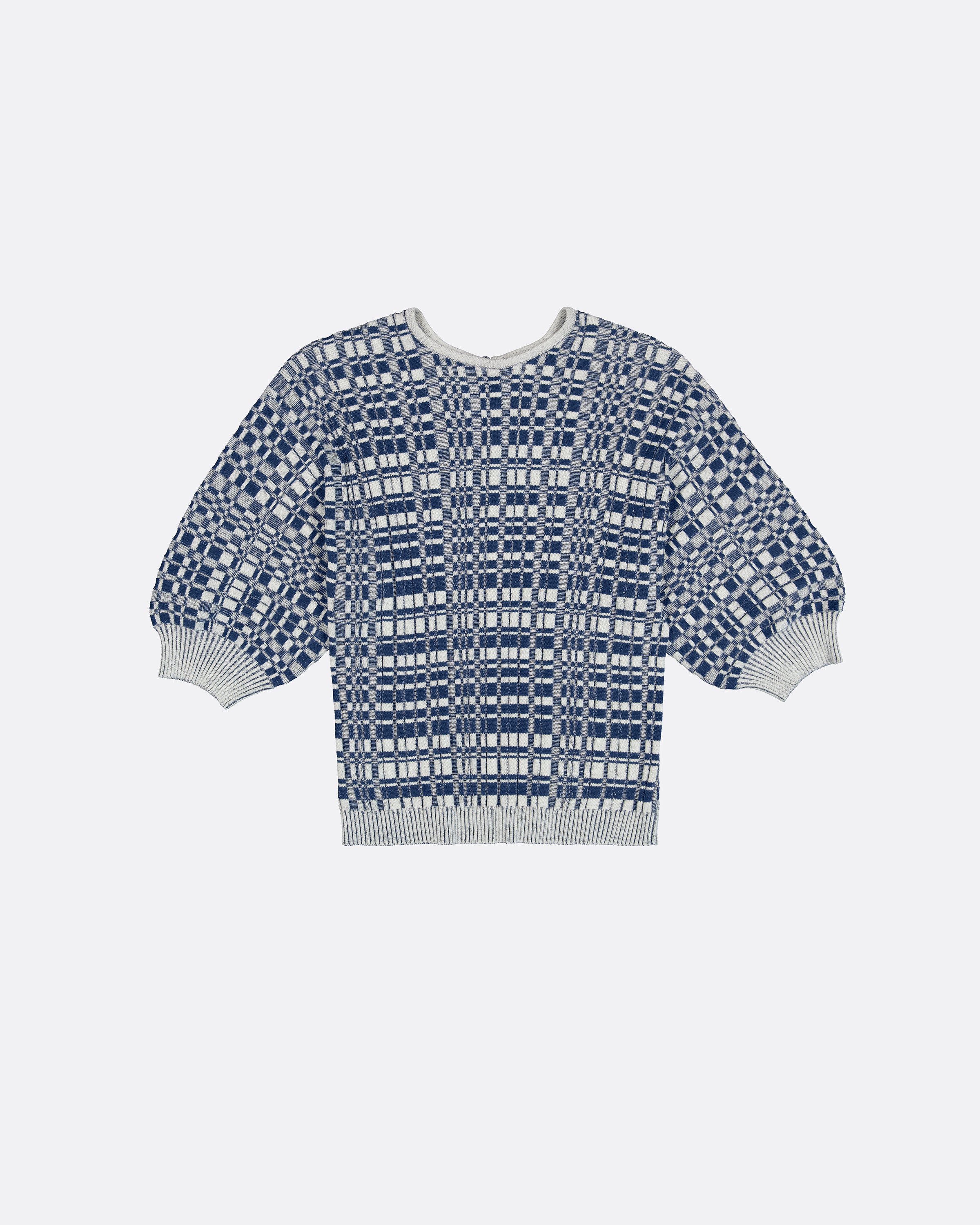 A short-sleeve knit sweater with a geometric blue and white pattern, featuring balloon sleeves and ribbed cuffs and hem, shown against a light gray background.