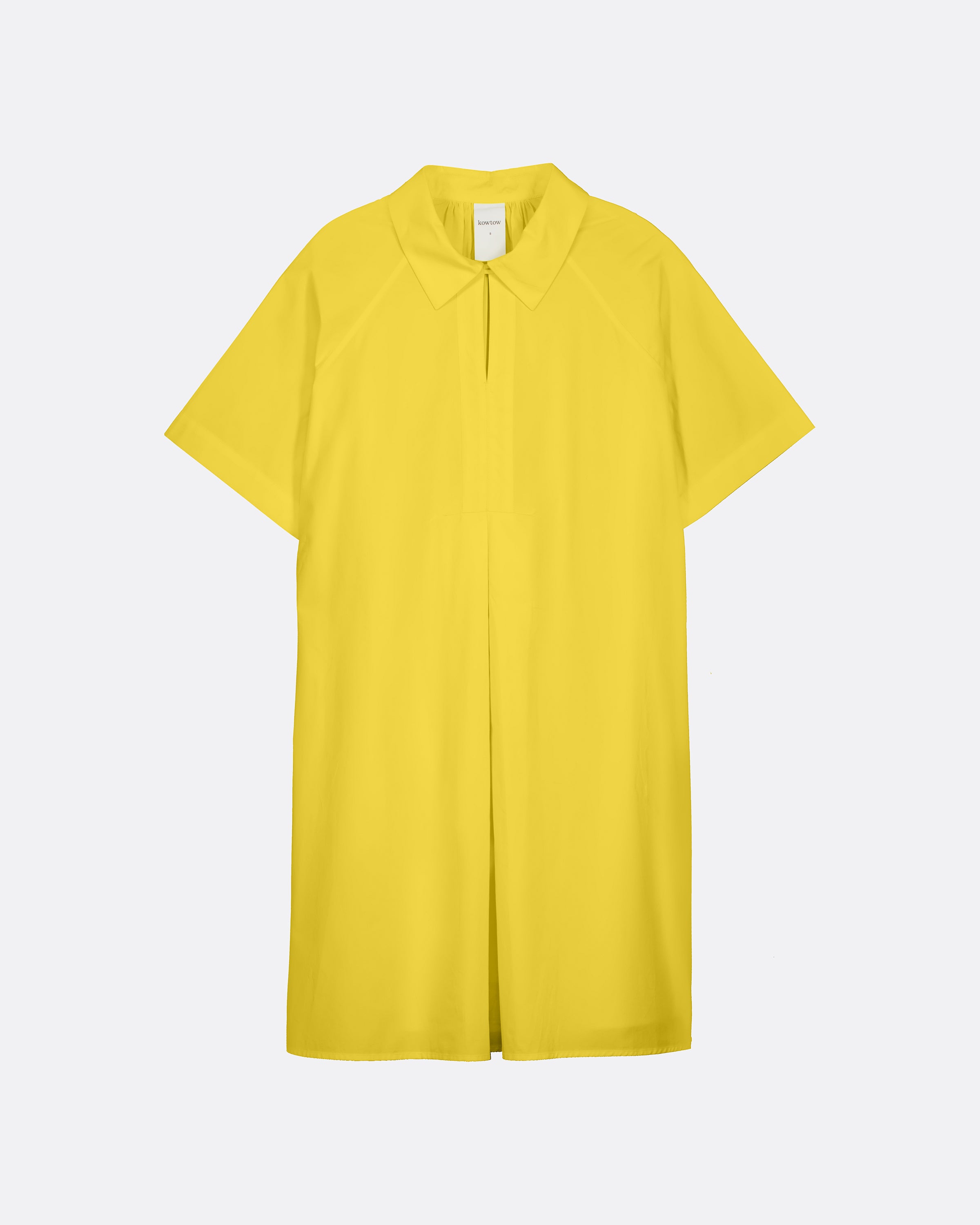A bright yellow short-sleeve polo shirt dress with a collar and front button placket, shown flat against a light gray background.