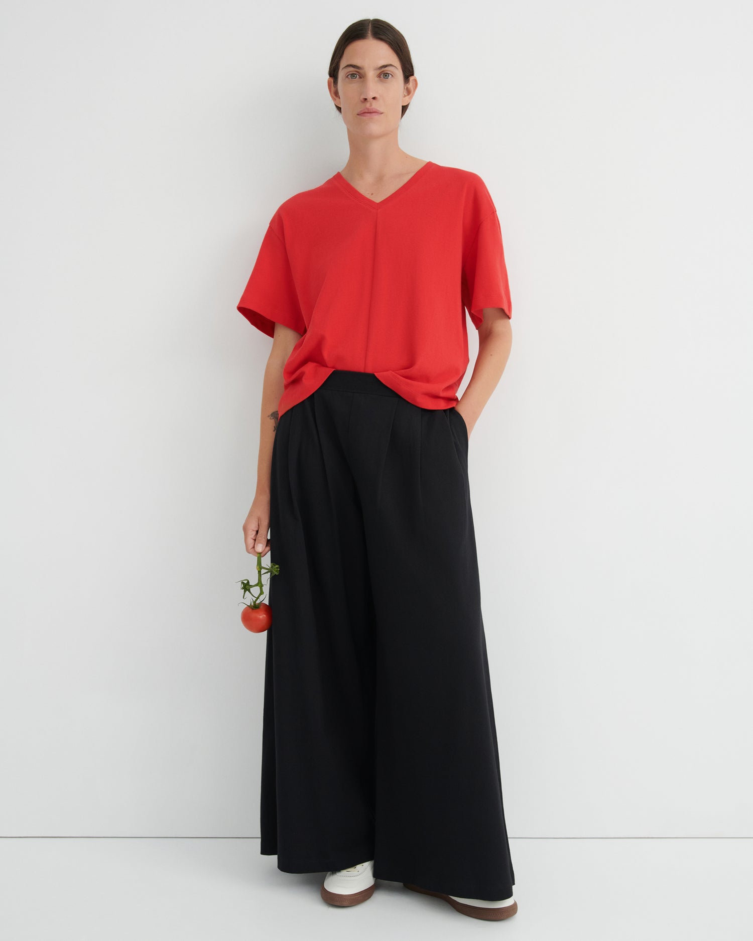 Essentials - Unity Tee in Poppy red and Black drape pants.