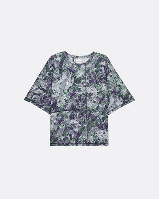 A short-sleeve cropped top with a purple, green, and white abstract marble or floral pattern, displayed flat against a light gray background.