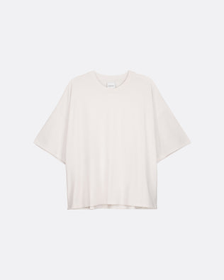 Off white t-shirt on a light beige background