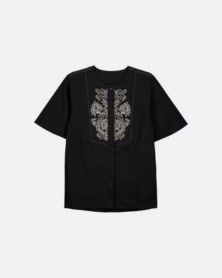 A black short-sleeve button-up shirt with ornate silver embroidery on the front chest panel, displayed against a light gray background.